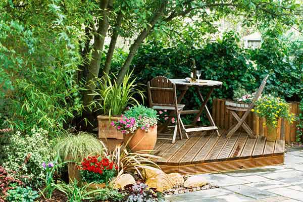 A deck with a plant border.