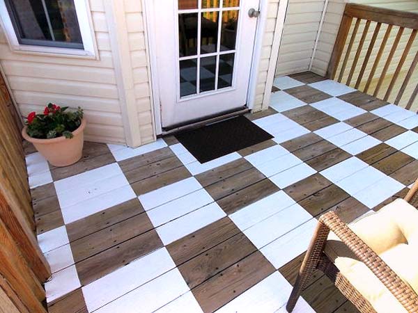 A deck with a checkerboard painted floor.