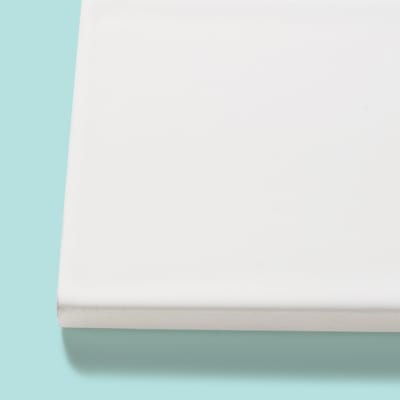 Bright white subway tile with traditional square edges.