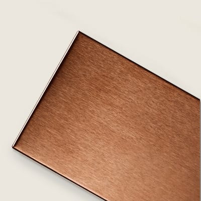 Copper-finish metal subway tile over porcelain base.