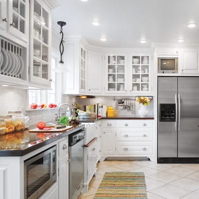 Farmhouse-style kitchen with glass-front cabinets.