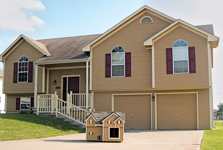 Duplex dog house built for two dogs with cedar trim details.