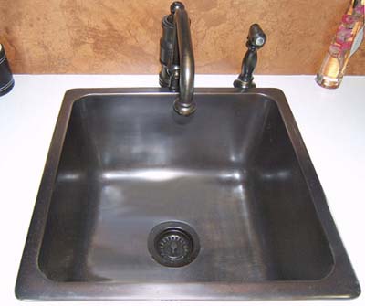 Image of a large square metal bar sink