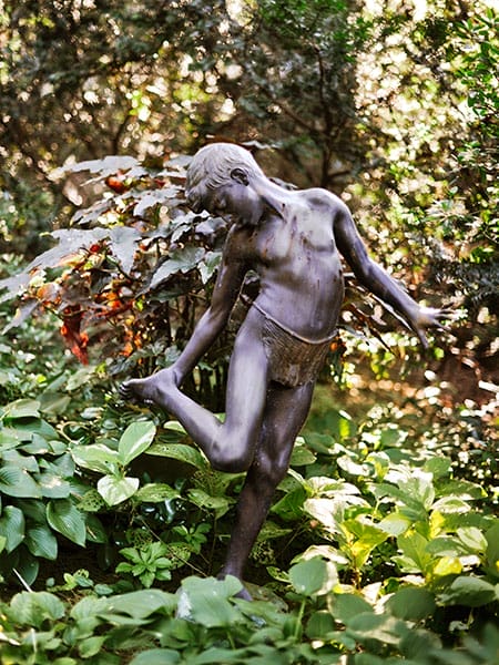 A garden with an ornament statue.