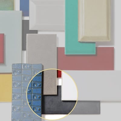 Distressed subway tile mimicking antique pewter metal finish.