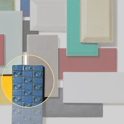 Contoured subway tile ends creating unique grout line pattern.