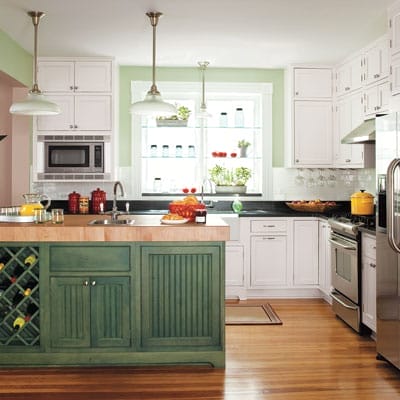 Kitchen with white cabinets and pendant lighting.