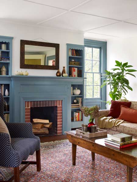 A living room with blue woodwork