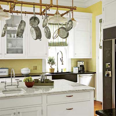 Kitchen with hanging pots and pans.