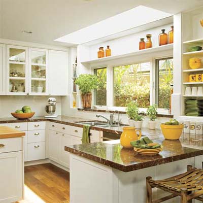 Bright white kitchen with large windows.
