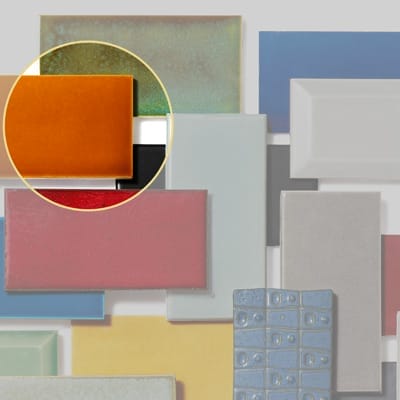Orange subway tile sample with pumpkin-colored gloss finish.