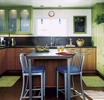 Modern kitchen makeover with green pantry wall and open layout.