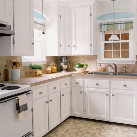 Charming kitchen renovation with new upper cabinets and trim.