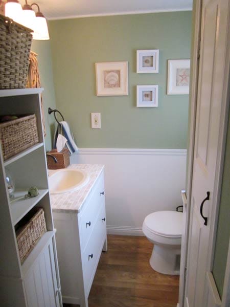 A tiled vanity countertop in a small bathroom.