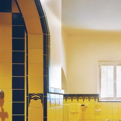 Arched doorways in a bathroom add to the vintage art deco look.