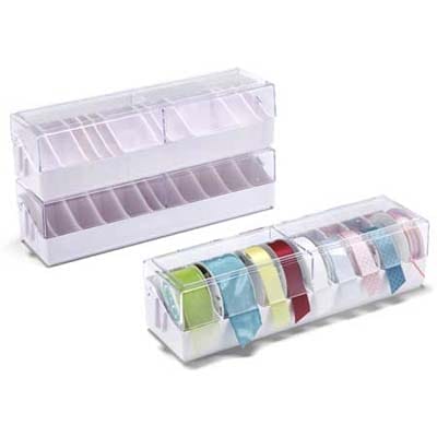 Stacking ribbon dispenser box with adjustable dividers and side openings.