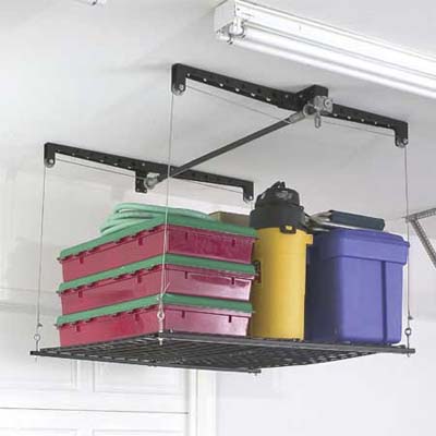 Overhead garage storage system with hand-crank operation for seasonal items.