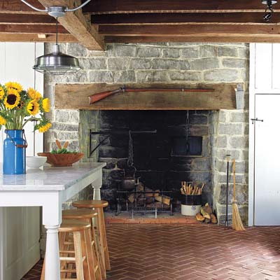 A large fireplace in the kitchen