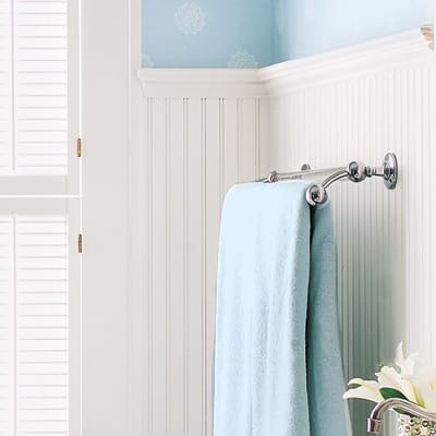 Wainscoting on bathroom walls to give them a vintage look in a modern space.