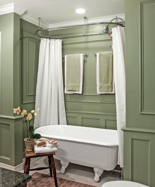A clawfoot tub in a small bathroom.