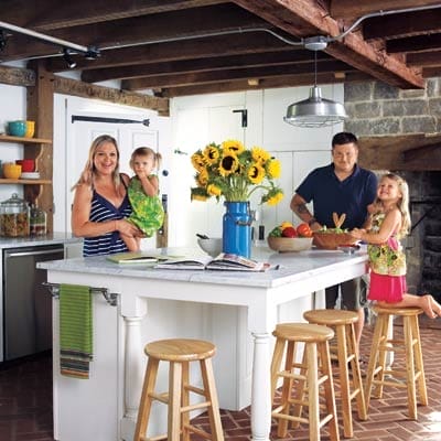 Homeowners and their children enjoying their kitchen