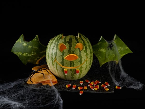 Image of a watermelon carved into a jack-o-lantern