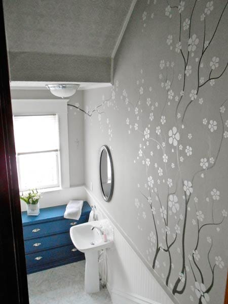 Steps leading down to a small bathroom.