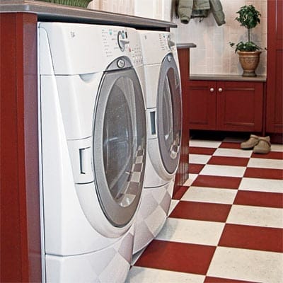 laundry room with red checkerboard floors