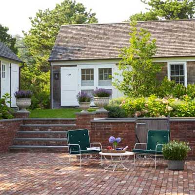 A well-manicured patio and garden area