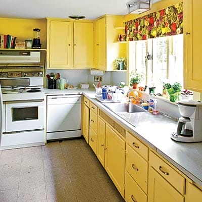 Kitchen before renovation showing narrow, isolated space with limited counter area.