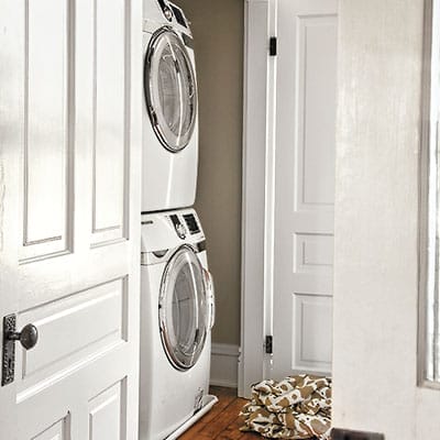 Laundry room with stacked machines