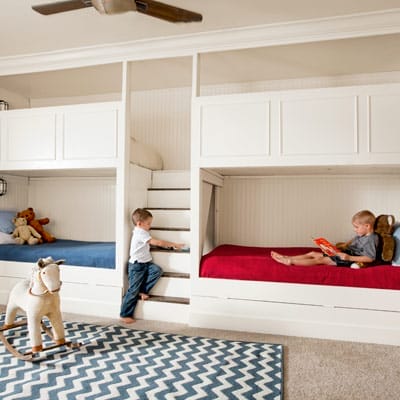 Built-in bunk beds maximizing floor space for children's play area.