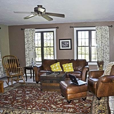 Plain living room before makeover with beige walls.