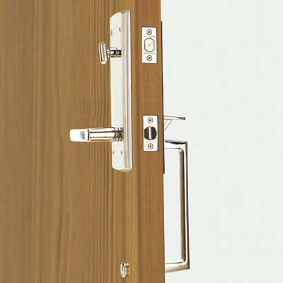 A tubular entry set on a wooden door.