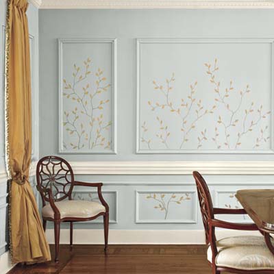 A wall with tiny twigs painted on to it.