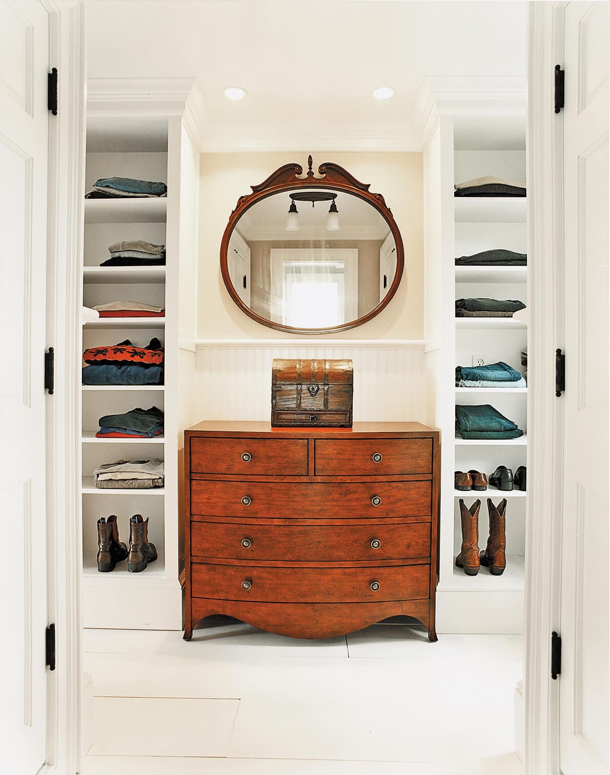 A dressing room with shelves for storage.