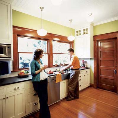 Two homeowners enjoying a remodeled kitchen