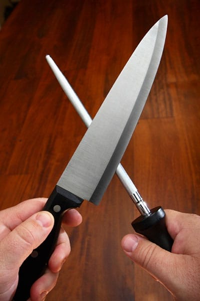 Someone sharpening a knife