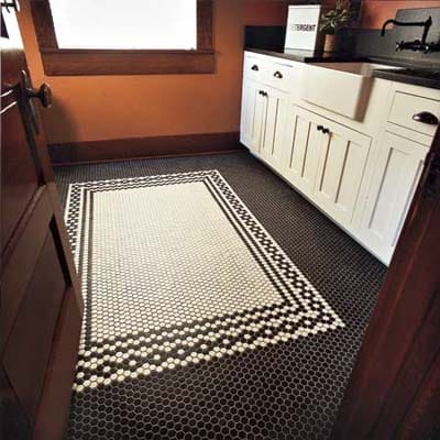 Mosaic-patterned floor in the laundry room