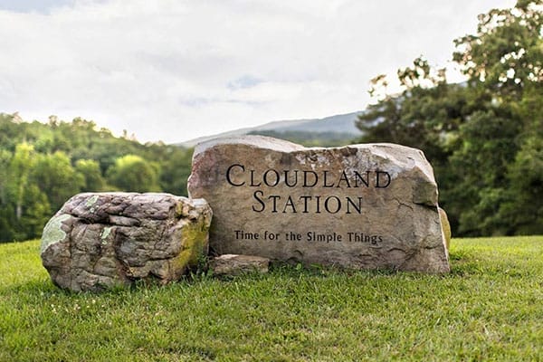 Rock sign engraved with "Cloudland Station, Time for the Simple Things".