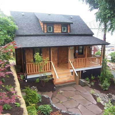 The California house with a restored front porch and front yard