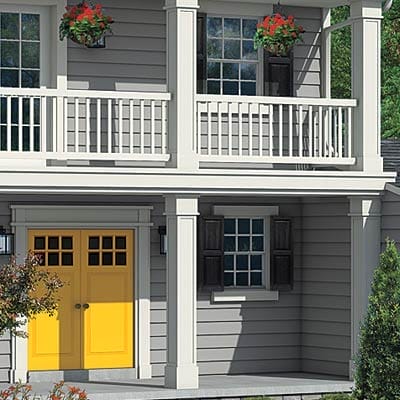 Close-up of beefed-up square porch columns replacing original round columns.