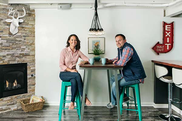 Bill and Melissa Forrest sitting in their basement.