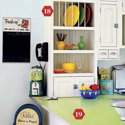 Retro diner kitchen with colorful plate cubbies and lime laminate counter.
