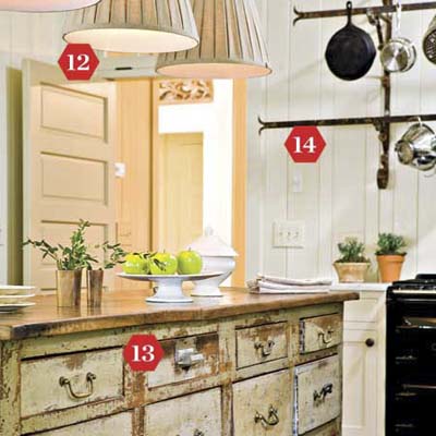 Rustic kitchen with pendant lighting and repurposed seed counter island.