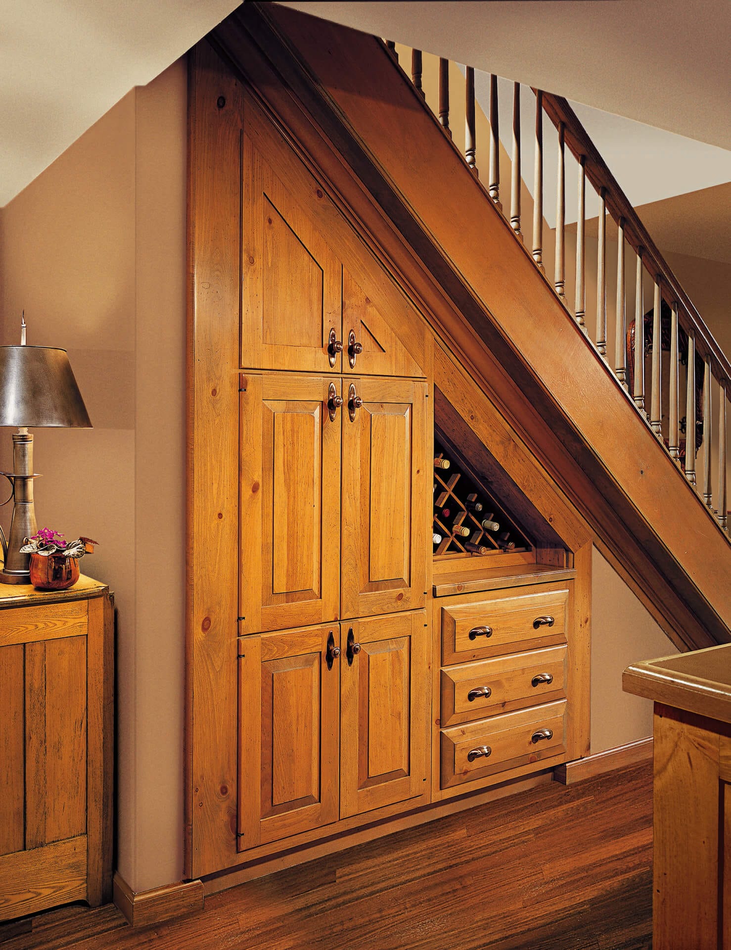 A wine cellar built below a stairwell.