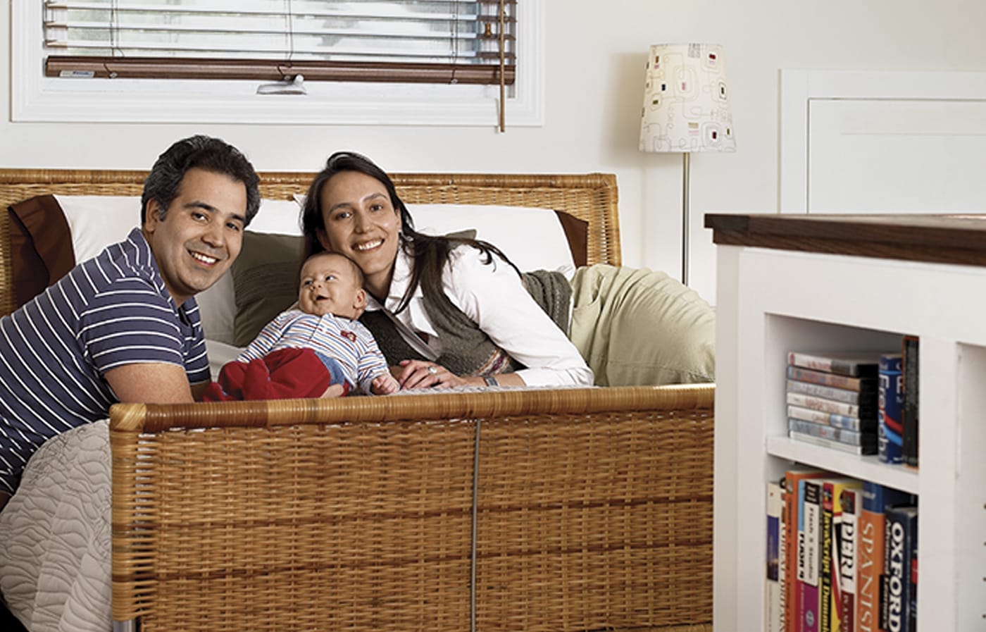 The homeowners posing with their baby.