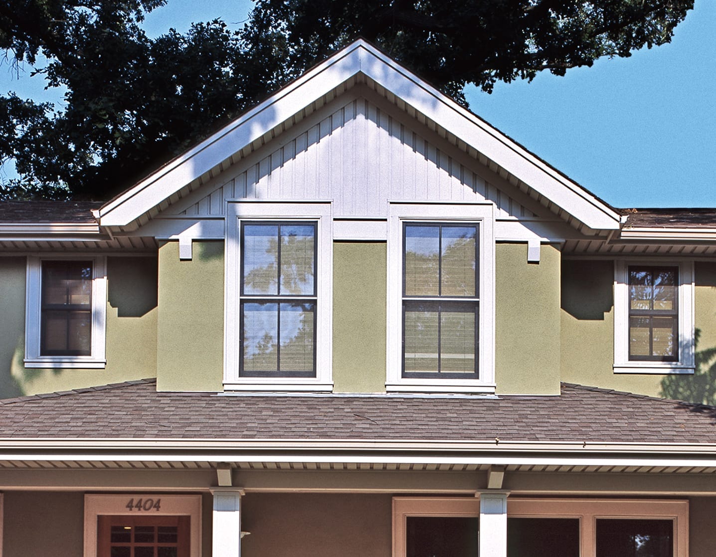 Modern double-hung windows with white tri.