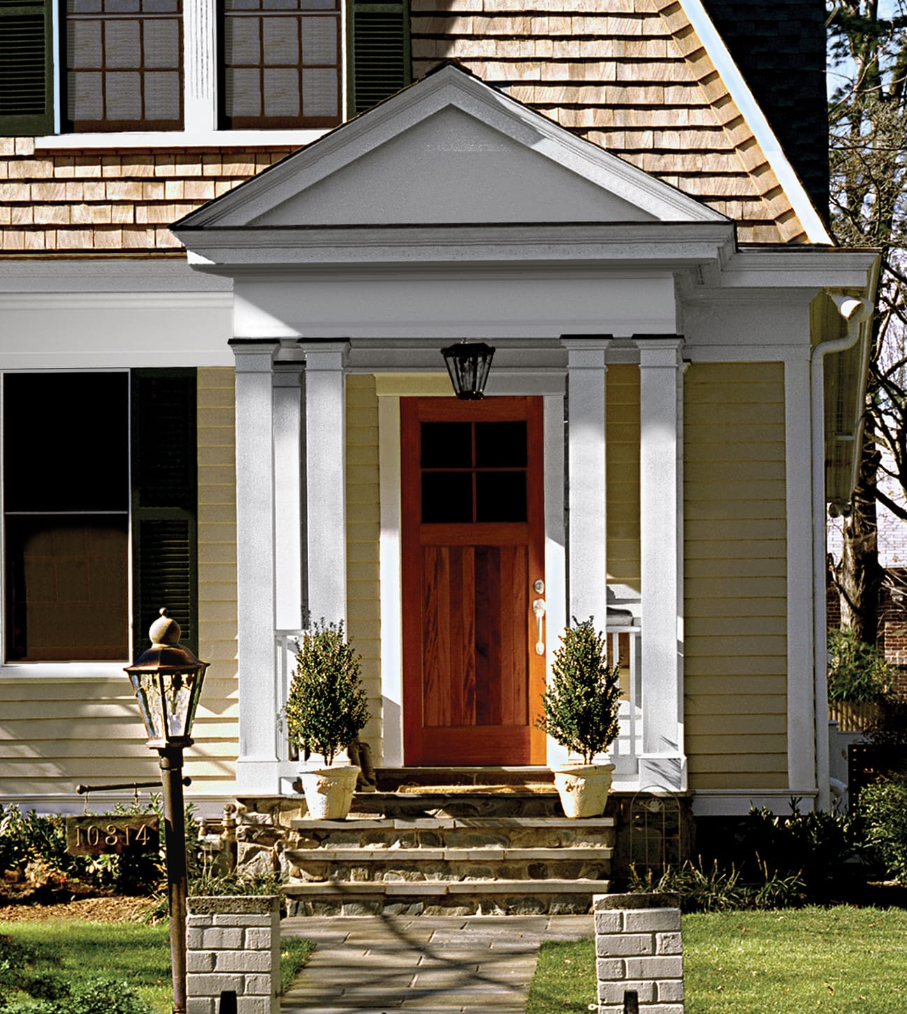 Pair of decorative planters flanking front entrance.