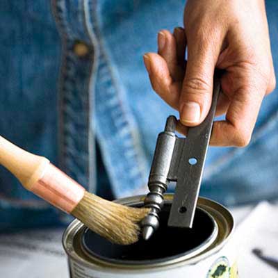 Someone restoring hardware with shellac